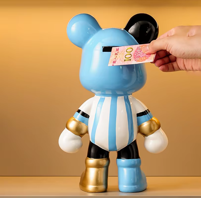 Broke Bear's Piggy Bank: Kickin' It with a Football-Obsessed Money-Saving Sculpted Buddy!